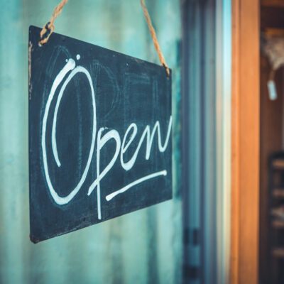 Rustic,Open,Sign,Hanging,In,The,Door,Of,A,Coffee